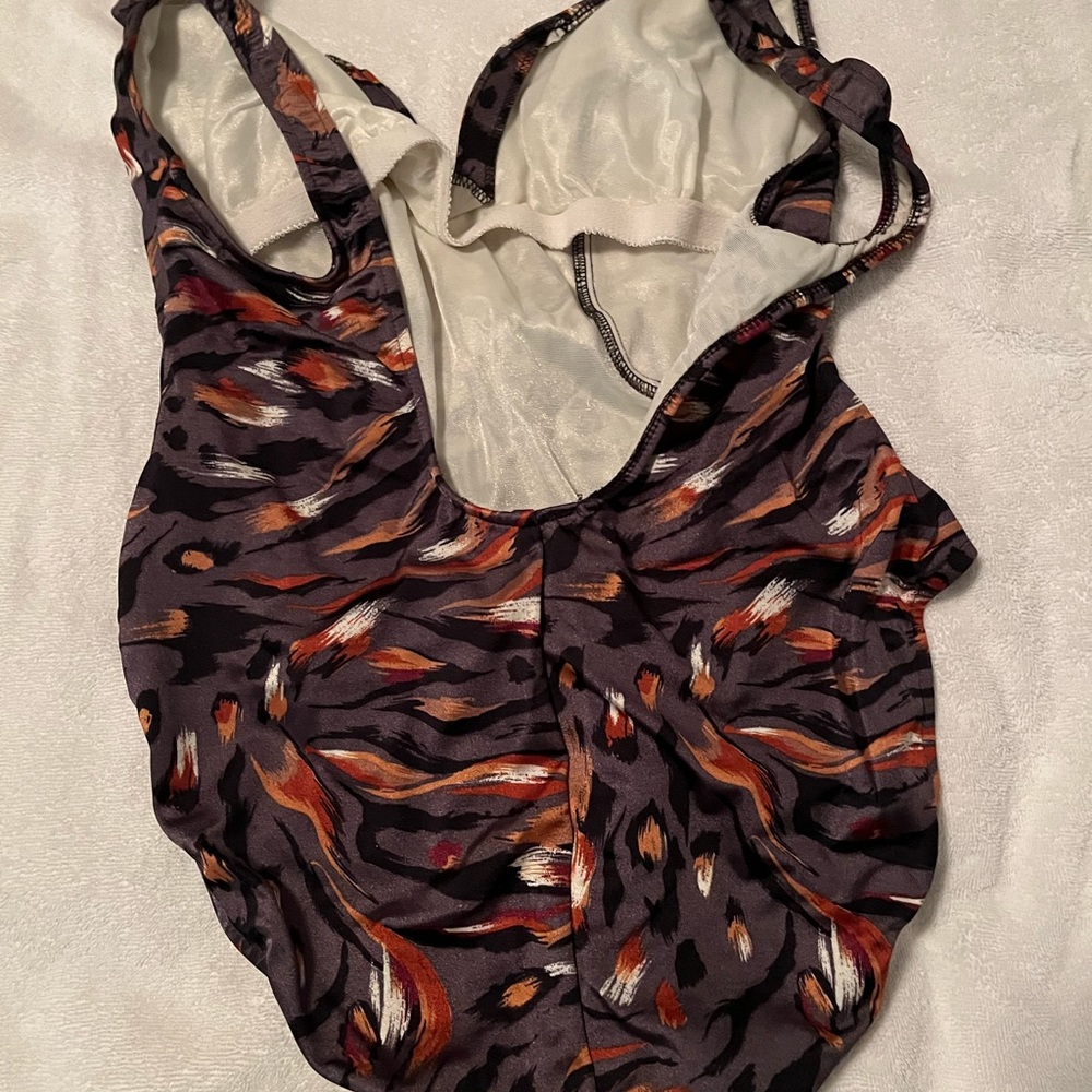 Slightly used multi color brown/black/orange one piece swimsuit.